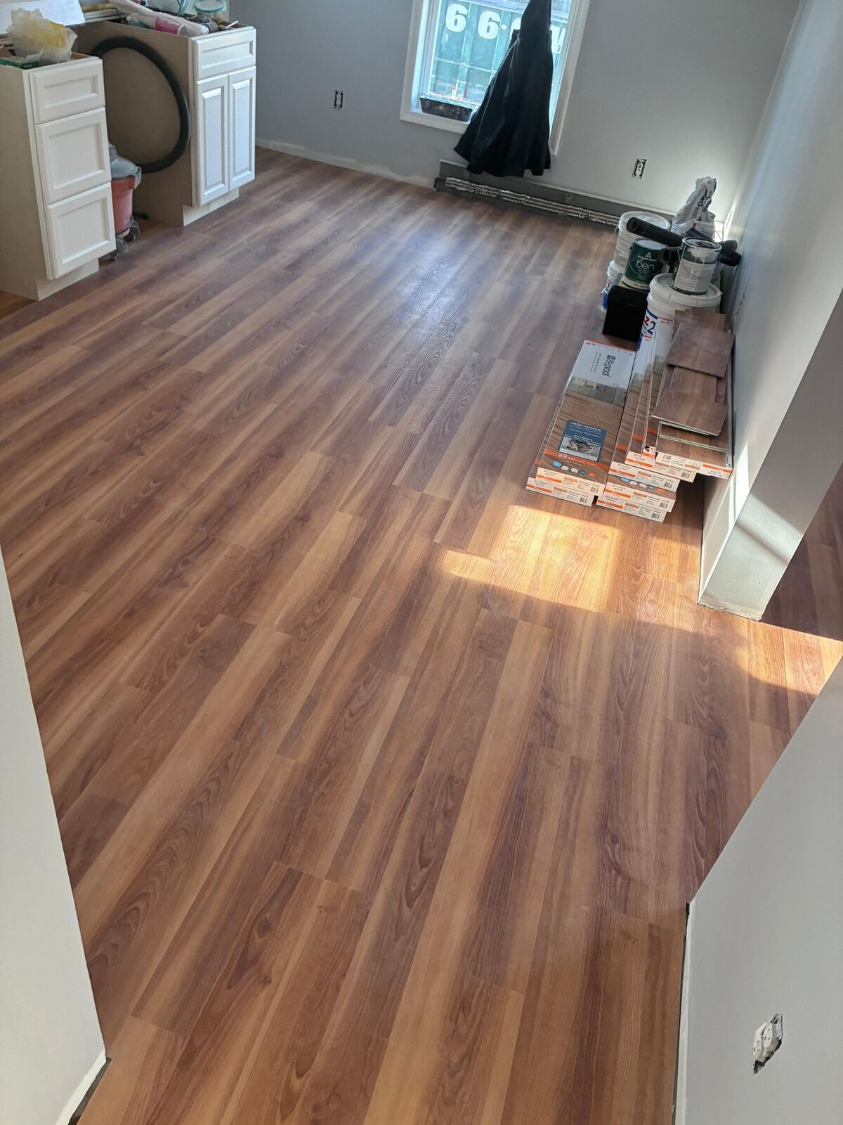 Apartment flooring installation with wood-look finish by Cordeiro Flooring